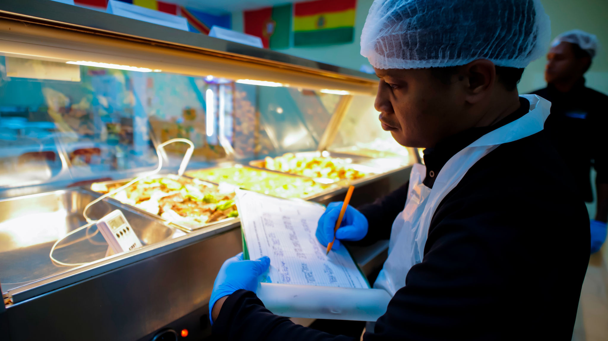 JPFSL_Kitchen_Staff_Completing_HACCP_Paperwork